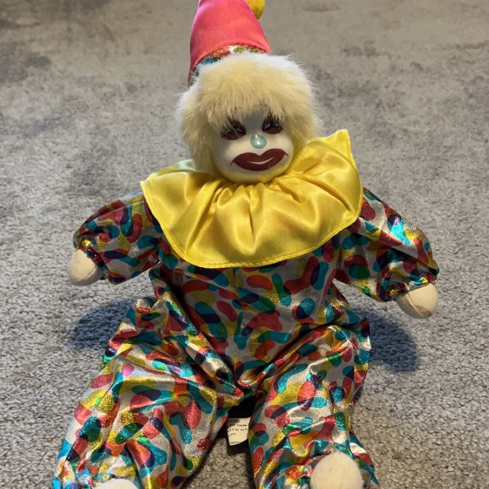Clown doll with wind up music box